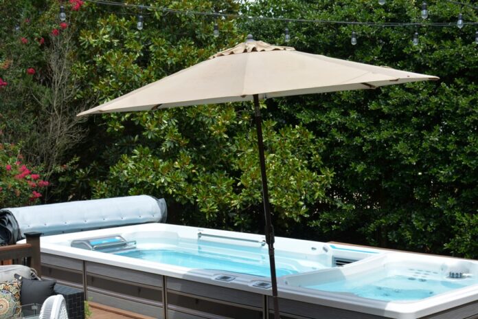 view-spa-swimming-pool-with-sun-shade-umbrella-by-trees